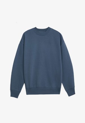 Sudadera de felpa en azul oscuro, con cuello redondo, mangas largas, puños acanalados y dobladillo. Textura suave, sin patrones ni gráficos visibles.