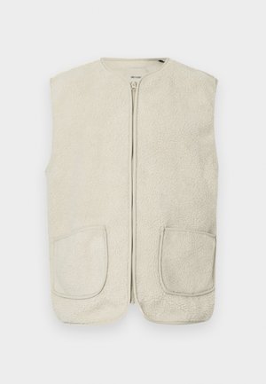 Krémovo sfarbená fl�ísová vesta so zipsom vpredu, okrúhlym výstrihom a dvoma prednými vreckami. Tkanina má jemný, textúrovaný povrch.