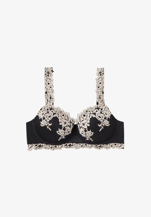 Sujetador con aro negro con detalles de encaje floral beige en las copas, tirantes y banda, con bordes ondulados y acentos de tela de malla.