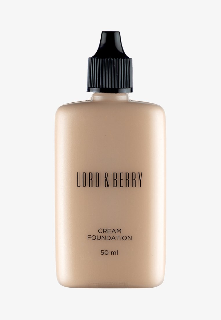 Creme-Foundation in einer durchsichtigen Kunststoffflasche mit schwarzem Ausgießer, beschriftet mit "LORD & BERRY", 50 ml Kapazität. Hellbeige Farbe.