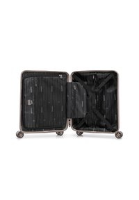 Valise rigide ouverte avec un intérieur noir à motif, des compartiments latéraux zippés et des sangles croisées ajustables à l'intérieur, montée sur quatre roulettes pivotantes.