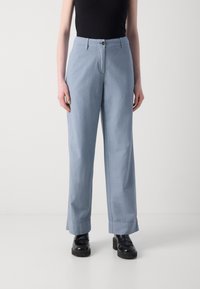 Light blue, wide-leg trousers made of soft fabric with a button closure and belt loops. Features a clean, unembellished design.