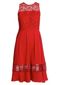 Robe sans manches rouge avec un corsage en dentelle, une jupe lisse et un ourlet évasé agrémenté de dentelle en bas.