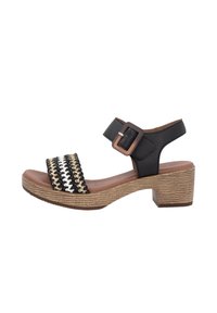 Black leather open-toe sandal with a woven black, white, and gold strap, featuring a square brown buckle and a textured block heel.