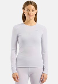 Light purple long-sleeve thermal top with a ribbed texture and embroidered logo on the chest. Features flat seams and a crew neck design.