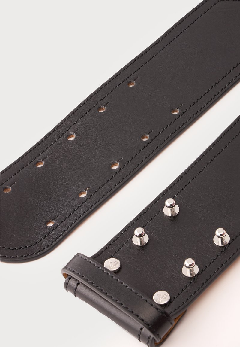 Black leather belt with multiple adjustment holes and four silver metal studs, laid flat against a white background.