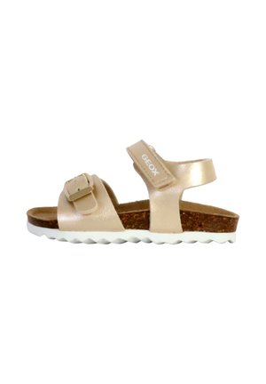 GEOX sandaler med en lys beige læderoverdel, to justerbare stropper og en korksål. Hvid gummisål med et bølgemønster.