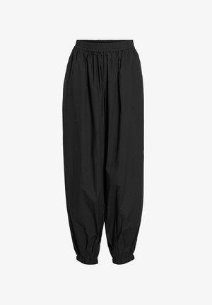 Black relaxed-fit pants made of lightweight material, featuring an elastic waistband and tapered cuffs at the ankles. No visible patterns.