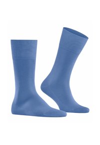 Chaussettes en coton bleu clair avec une texture lisse, des poignets côtelés et une longueur classique. Aucun motif ni accent supplémentaire présent.