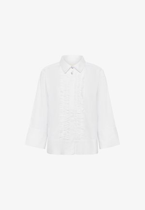 Balta marškinėliai su struktūrizuotu dizainu, turintys raukšlėtą priekį, apykaklę ir trijų ketvirčių ilgio rankoves. Pagaminti iš lygaus audinio su subtiliu blizgesiu.