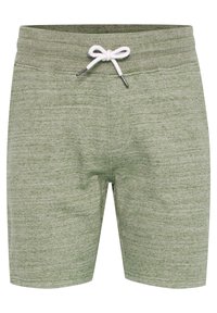 Pantaloni corti verde heather realizzati in tessuto morbido, dotati di chiusura con coulisse e vestibilità rilassata. Lunghezza corta con dettagli testurizzati minimi.