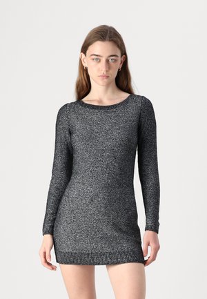 Knit dress in black and silver with long sleeves, round neckline, and fitted waist. Features a ribbed hem and sparkly texture.
