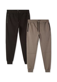 Dwie pary spodni dresowych: jedna czarna, a druga ciemnoszara. Obie mają elastyczny pas, kieszenie na zamek błyskawiczny oraz zwężane nogawki o gładkiej fakturze.