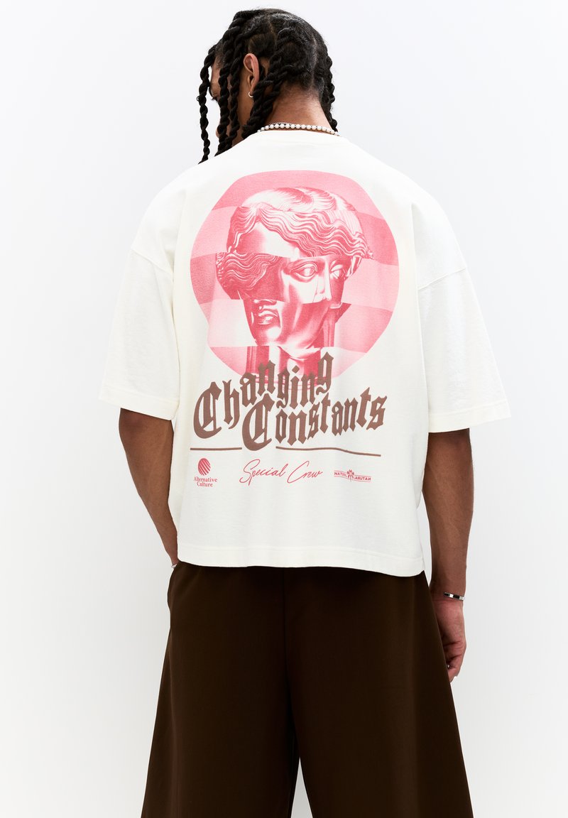 Short-sleeve, cream-colored T-shirt featuring a pink graphic design of a classical bust and text reading "Changing Constants" on the back.