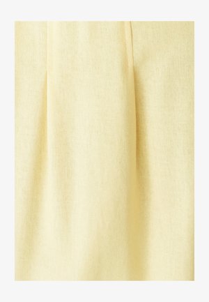 Hele kollane kangas pehme tekstuuriga, millel on vertikaalsed voltide lisadimensiooniks. Materjal näeb välja kerge ja õhuline.