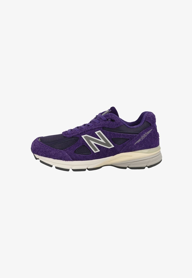 Purple athletic shoes featuring a textured upper with mesh and suede, a cushioned sole, and reflective accents on the side.
