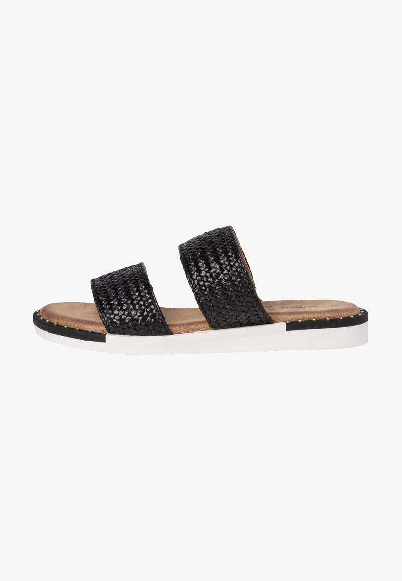 Black woven slide sandal with two broad straps, tan footbed, white sole, and gold accent studs along the edge. Flat and open-toed design.