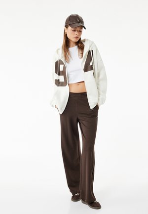 FLARED - Pantalones deportivos - brown