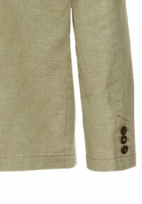 Lichtbruine, gestructureerde blazer mouw met een subtiel ruitpatroon. Bevat vier donkere knopen aan de manchette voor sluiting.