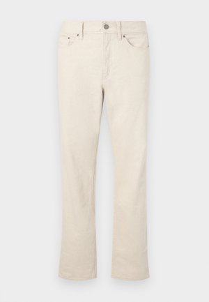 Beige bukse i bomullsblanding med rett ben-design. Har en frontknapp og glidelås, fem lommer, og subtile sømdetaljer.