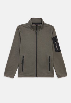 Bruine jas met volledige ritssluiting en textuur, voorzien van een hoge kraag, twee ritssluitingszakken aan de voorkant en een met rits afsluitbare zwarte patchzak op de linkermouw.