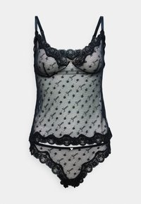 Camisón de encaje negro con tejido transparente y patrón floral, bordes en forma de ondas, tirantes ajustables y una braga a juego.