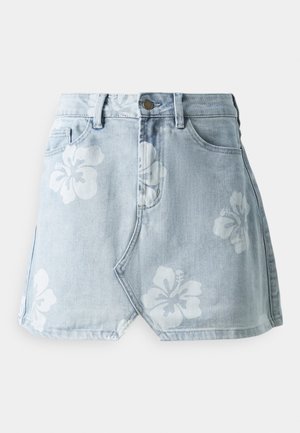 Denim mini skirt in light blue with white hibiscus floral print. Features a high waist, traditional pockets, and a diagonal hem design.