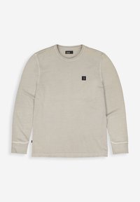 Beige Sweatshirt mit langen Ärmeln, aus weichem Material gefertigt, mit einem runden Halsausschnitt, einem kleinen schwarzen Logopatch und kontrastreichen Nähten.