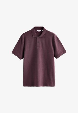 Kortærmet polo-shirt i mørk blommefarve med to knapper og klassisk krave, vist fladt på en hvid baggrund.