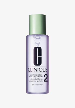 Clinique Clarifying Lotion 2 in a clear bottle with a green cap. Label features black text and a graphic logo, with a purple liquid inside.