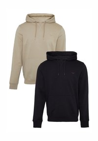 Dos sudaderas exhibidas: una de color beige claro con un bolsillo tipo canguro y una negra con un pequeño logo, ambas con capuchas ajustables.