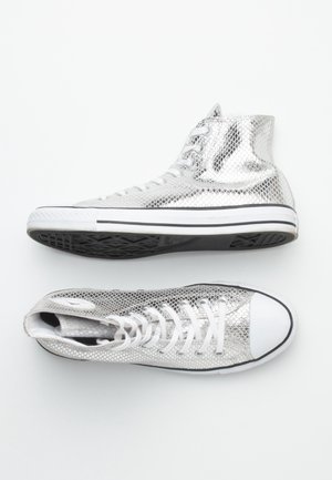 High-top sneakers with metallic silver snakeskin pattern, white laces, white toe caps, and black rubber soles on white background.
