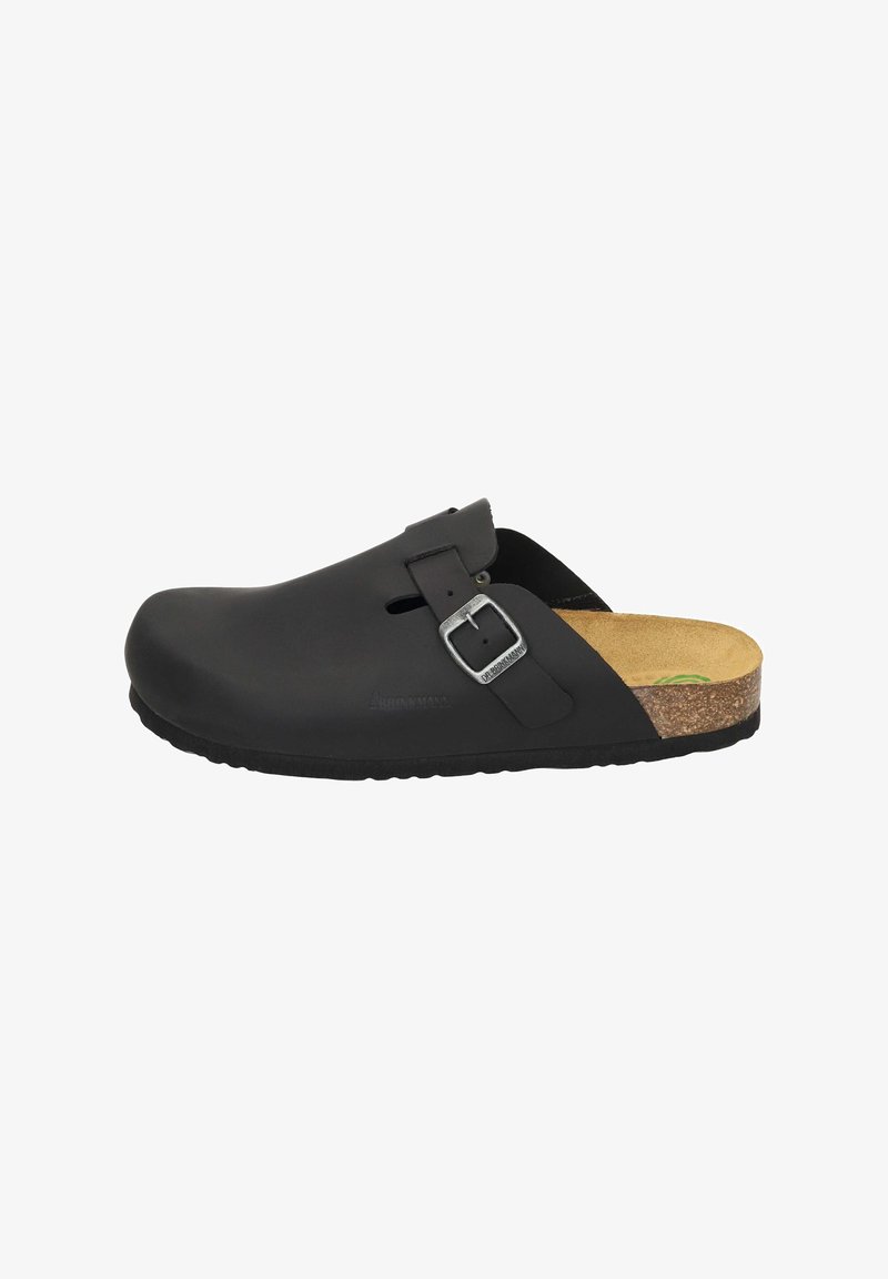Schwarze Clogs aus Gummi mit einem Fußbett aus Kork. Ausgestattet mit einem Riemen mit Schnalle, abgerundeter Zehenpartie, ausgeschnittenen Belüftungsöffnungen und einer strukturierten Sohle für besseren Halt.