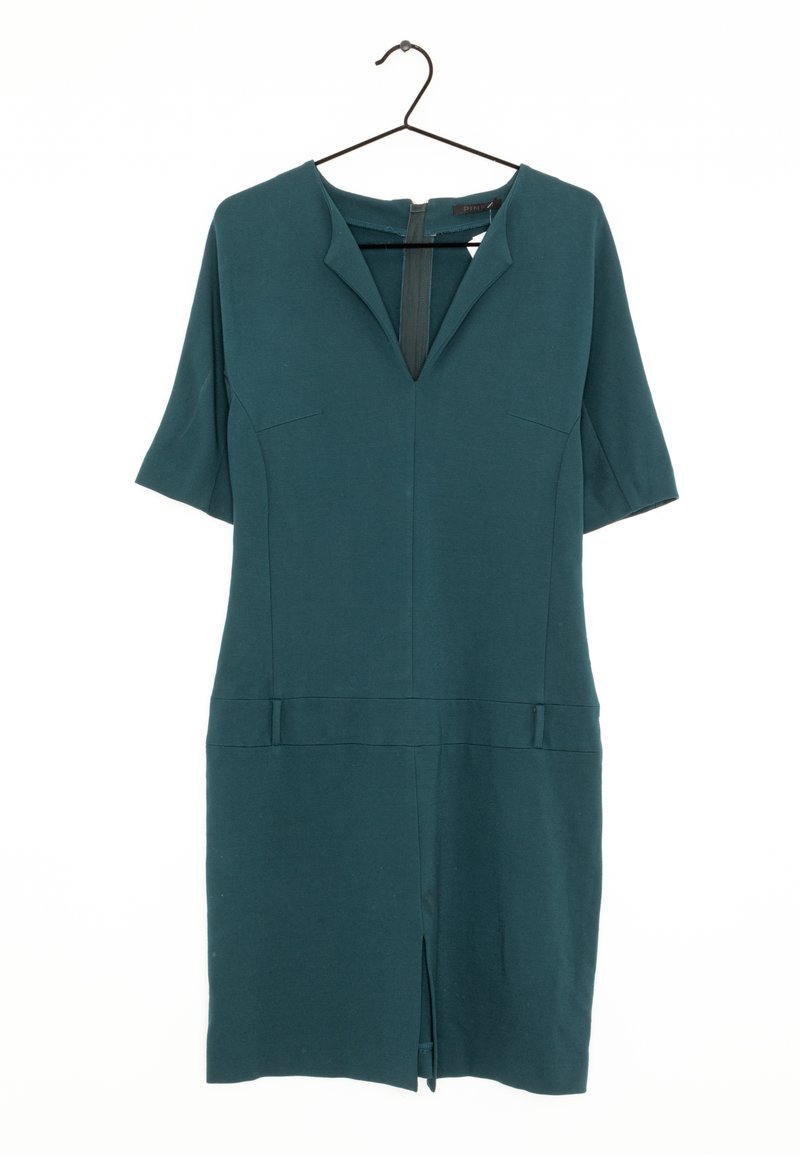 Tealfärgad klänning med korta ärmar, V-ringning och framficka. Slät tyg med minimalistisk design; har två framfickor och en dold dragkedja.