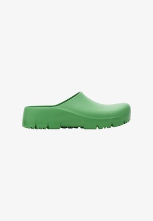 Sabot en caoutchouc vert avec une finition lisse, bout arrondi et semelle texturée présentant de petites rainures pour l'adhérence. Design léger et enfilable.