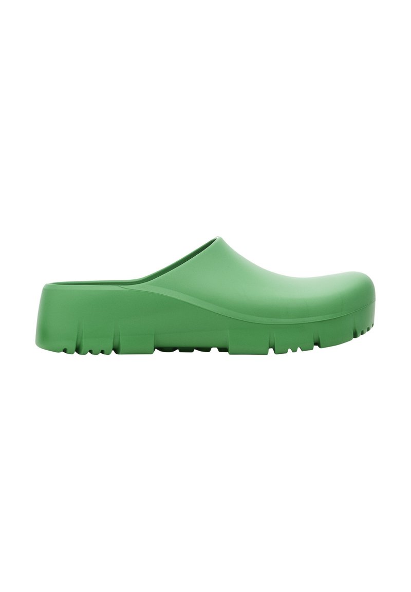Green rubber clog with a smooth finish, rounded toe, and textured sole featuring small grooves for grip. Lightweight and slip-on design.