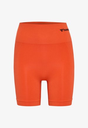 Pomarańczowe bezszwowe krótkie spodenki sportowe z wysokim stanem i czarnym logo "hummel" po lewej stronie paska.