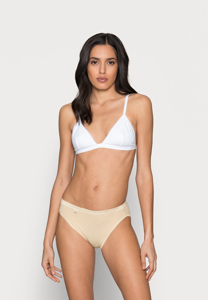 White triangle bralette and beige panties, smooth fabric, simple design, adjustable straps, soft waistband, minimal branding detail.