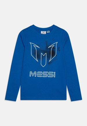 Long-sleeve blue t-shirt made of cotton, featuring a graphic design with a white logo and black dots overlaid. Text reads "MESSi."