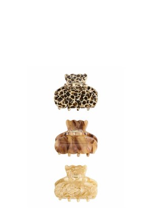 Three hair clips: top in brown and tan leopard print, middle in swirling brown tones, bottom in light beige with floral pattern, all glossy finish.