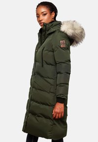 Green puffer coat with a faux fur hood, long design, zippered chest pocket, and patch detail on the sleeve. Features ribbed cuffs.