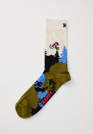 Sock with mountain biking design, biker jumping over trees, green, blue, black, white colors, and "HAPPY" text near the toe.