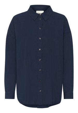 Tume navy sinise pika varrukaga särk klassikalise kraega, nööbiga esise sulgemise ja vabalt langeva istuvusega. Omab õrna tekstuuri ja ümarat alläära.