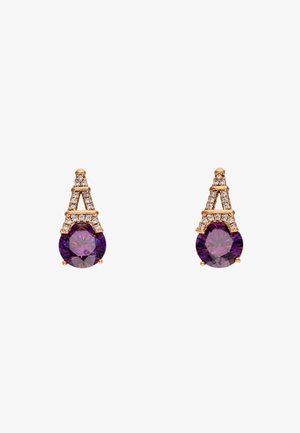 Gold-toned earrings featuring an ornate design, a round purple gemstone, and smaller clear accents above. Crafted with a textured finish.