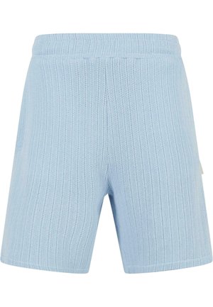 Light blue ribbed shorts with an elastic waistband. Material has a textured finish, featuring a side pocket and clean hem.