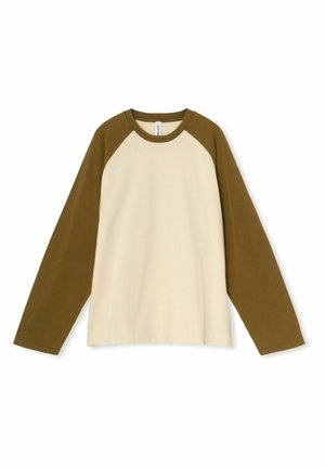 Cream and olive green long-sleeve shirt, featuring raglan sleeves, soft cotton material, and a relaxed fit. Minimalistic design.