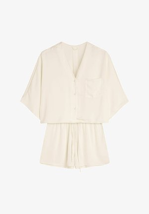 Lekka bluzka kremowa z dekoltem w serek, krótkimi rękawami, guzikami z przodu oraz kieszonką. Posiada ściągacz w talii, co pozwala na regulację dopasowania.