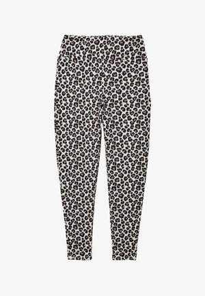 Leggings longs avec un motif léopard noir et marron sur fond blanc, dotés d'une large taille.