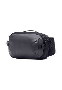 Borsa di tessuto nera con una superficie liscia, dotata di manico superiore, diverse cerniere e tasche laterali. Design compatto adatto per l'uso quotidiano.