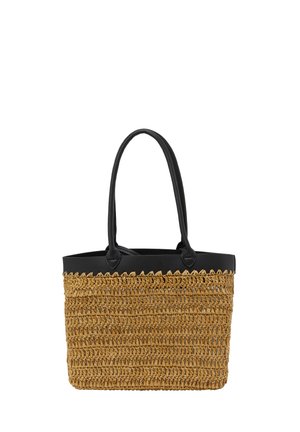 Gevlochten stro tas met zwarte leren handvatten, rechthoekige vorm, natuurlijke beige kleur en een gestructureerd oppervlak met gekartelde randen.